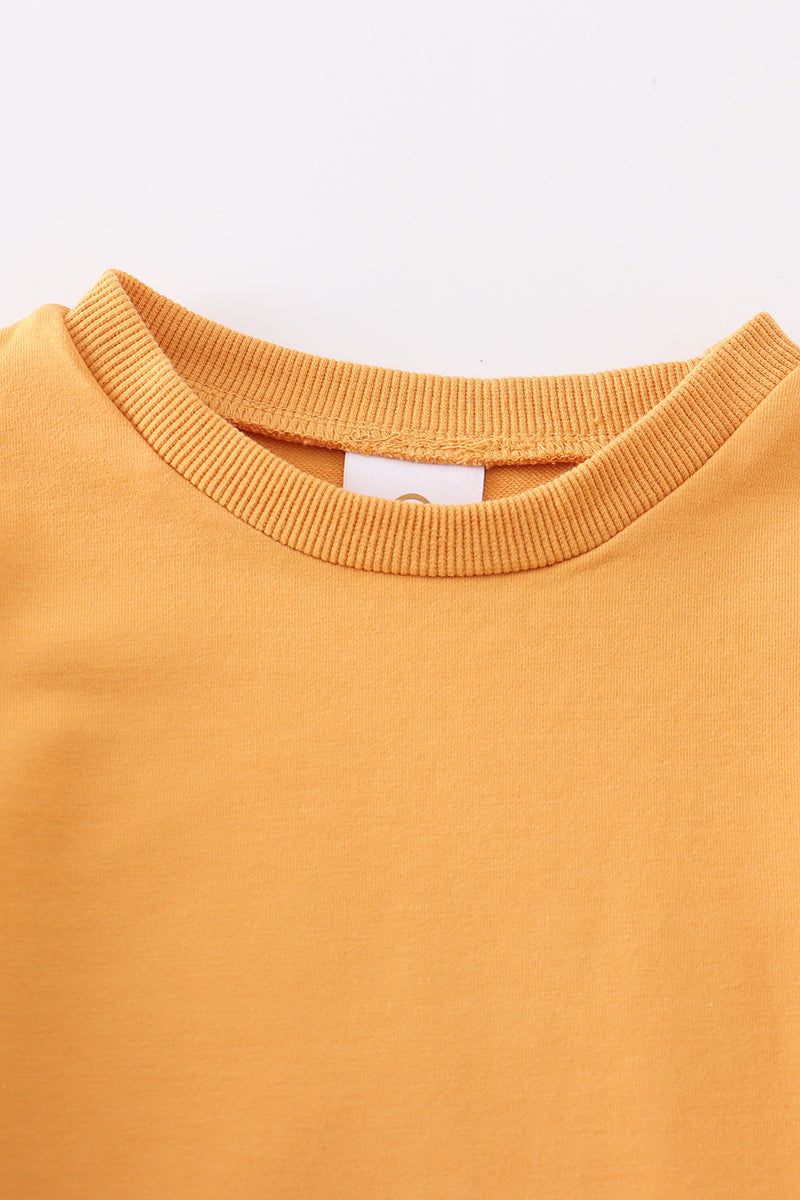 
                  
                    Mustard ruffle sweatshirt
                  
                