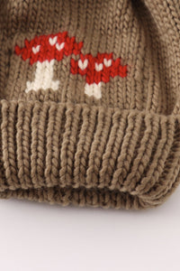 Brown pompom mushroom cable beanie