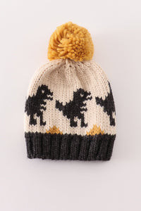 Black pompom dinosaur cable beanie